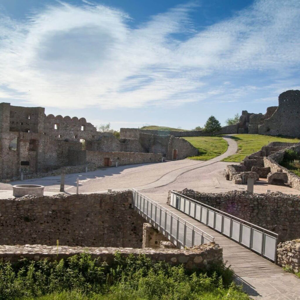 Scenic view of Devin Castle ruins on a sunny day, showcasing the historic stone structures and pathways, perfect for a one day trip from Bratislava to Devin