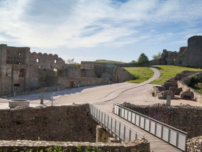 Scenic view of Devin Castle ruins on a sunny day, showcasing the historic stone structures and pathways, perfect for a one day trip from Bratislava to Devin