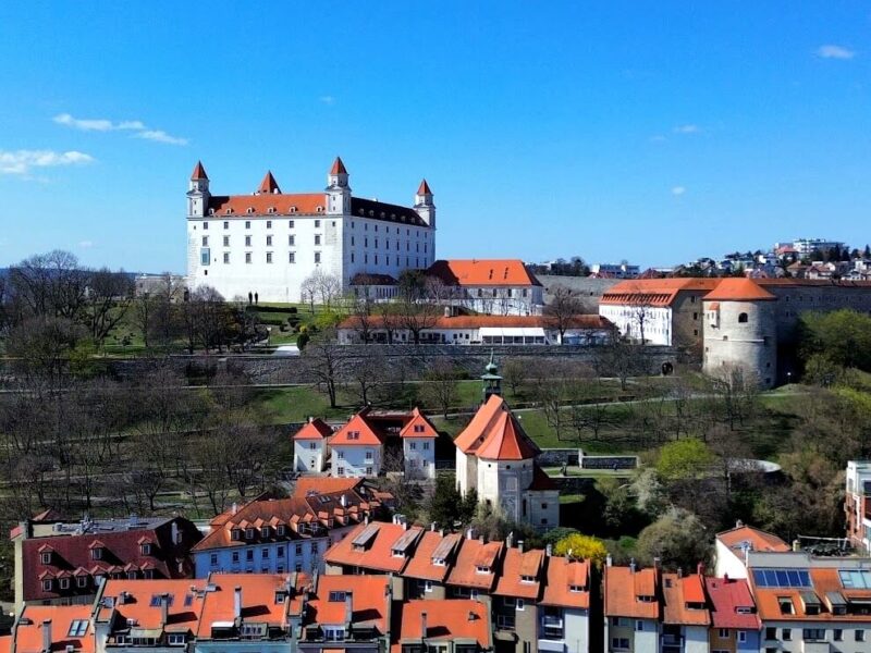 Aerial drone view of Bratislava Castle above the castle district and Danube embankment — the must-see landmark when spending 48 hours in Bratislava