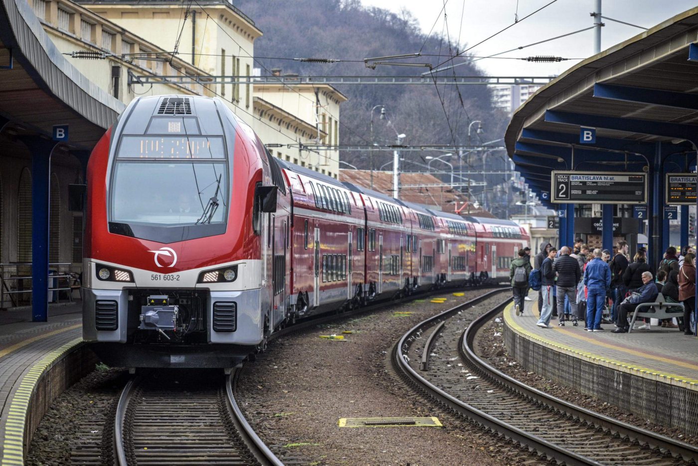 Modern ZSSK double-decker passenger train arriving at Bratislava Main Station platform 2 - best train travel option between Vienna and Bratislava