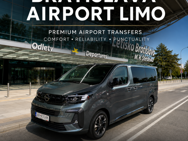 Black Mercedes-style Opel Vivaro VIP minivan parked outside Bratislava Airport (BTS) departures terminal, premium airport transfer service