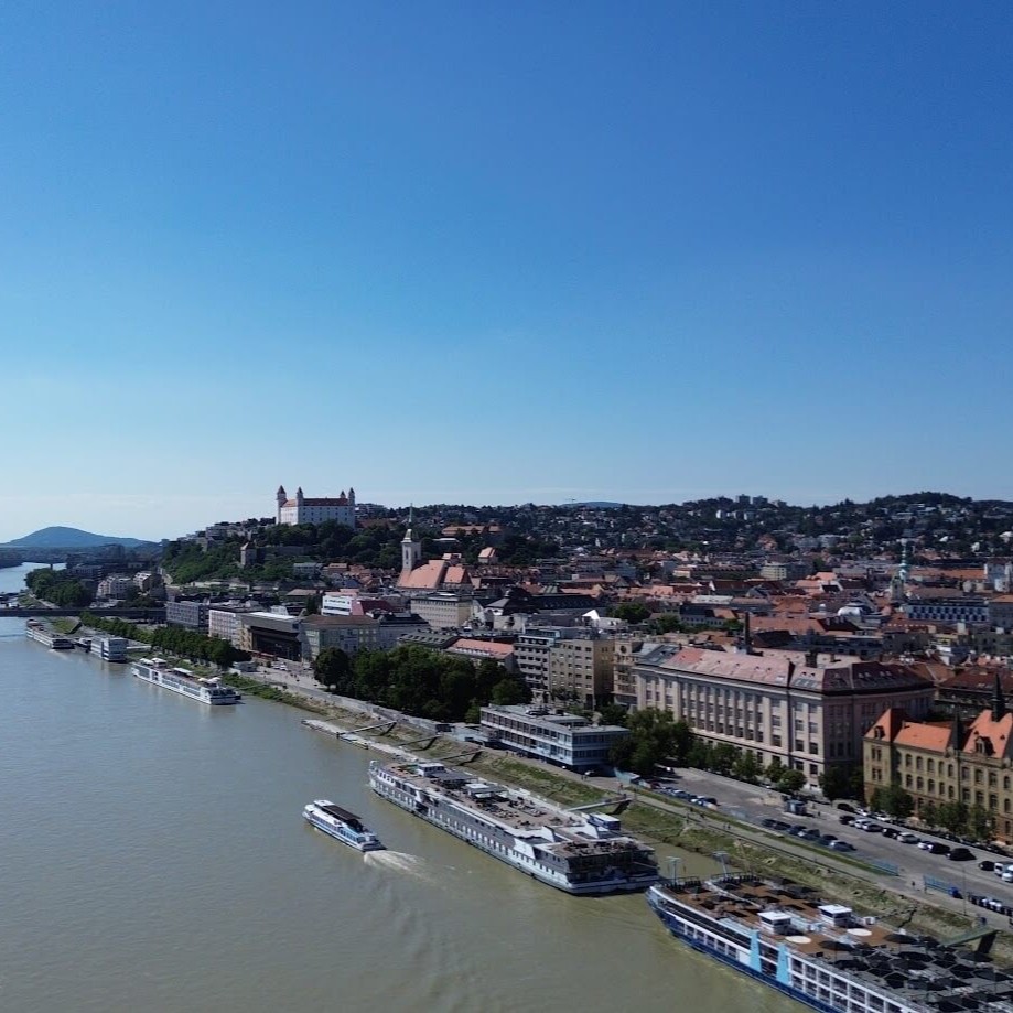 Bratislava skyline over the Danube, the river route marking the Bratislava to Budapest distance